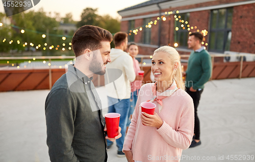 Image of friends with non alcoholic drinks at rooftop party