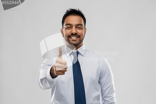 Image of indian businessman showing thumbs up