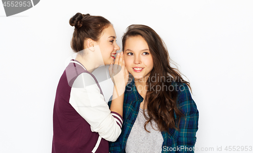 Image of teenage girls gossiping or sharing secrets