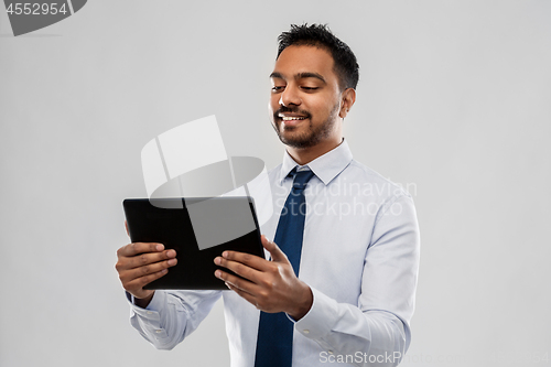 Image of indian businessman with tablet pc computer