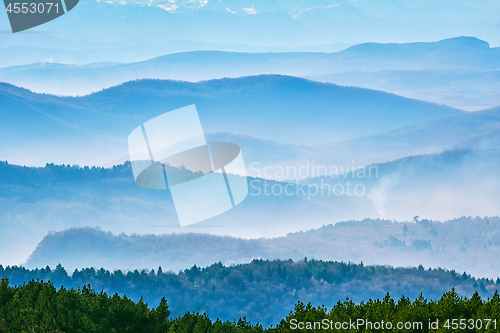 Image of Mountain Ranges in The Fog