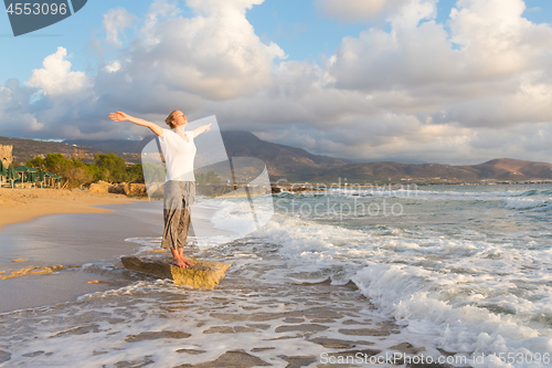 Image of Free Happy Woman Enjoying Sunset on Sandy Beach