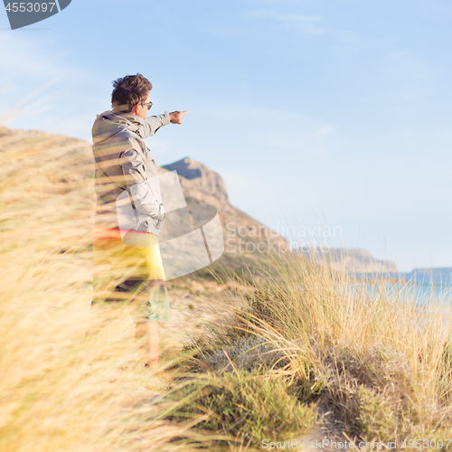 Image of Free active man enjoying beauty of nature.