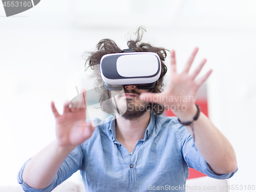 Image of man using VR-headset glasses of virtual reality