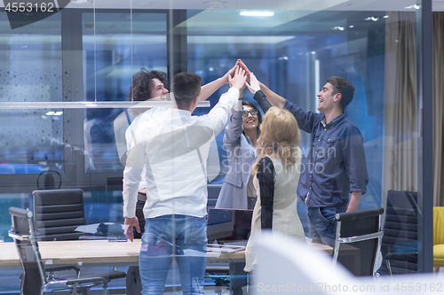 Image of startup Group of young business people celebrating success