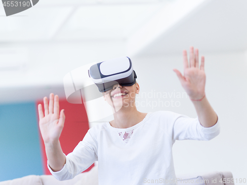 Image of woman using VR-headset glasses of virtual reality