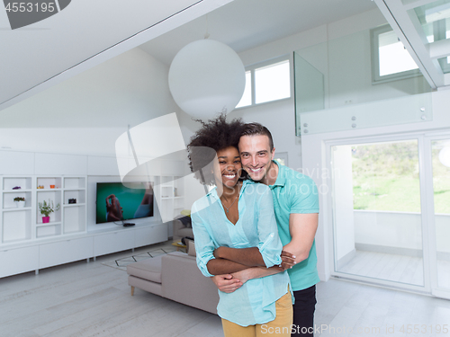 Image of multiethnic couple hugging