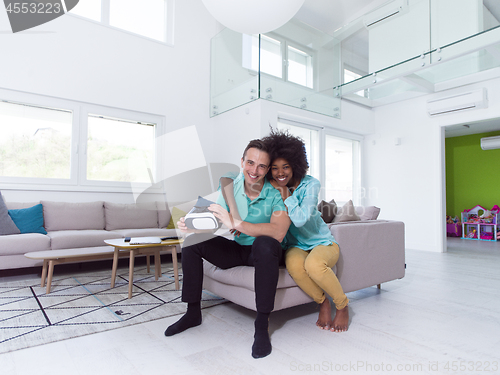 Image of Multiethnic Couple using virtual reality headset