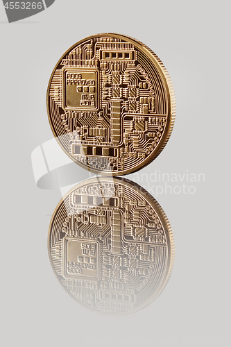 Image of Gold Bitcoin Coin on a gray background