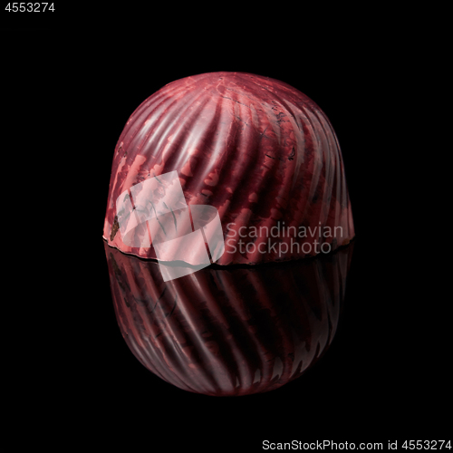 Image of chocolate candy on black background