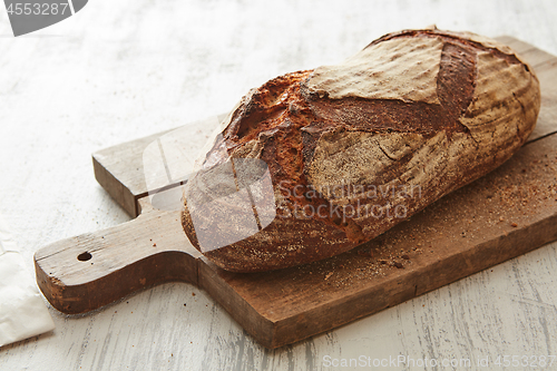 Image of Fresh bread on wooden board