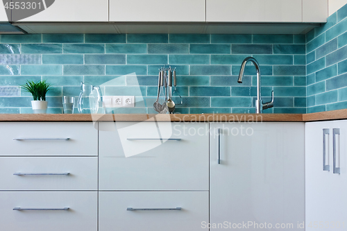 Image of cozy interior of a white kitchen