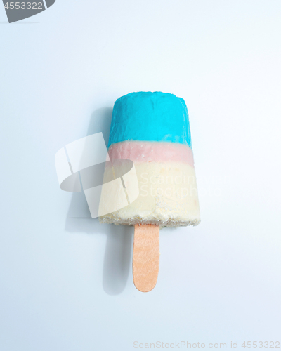 Image of Multicolored appetizing ice cream lolly on a gray background with copy space. Top view