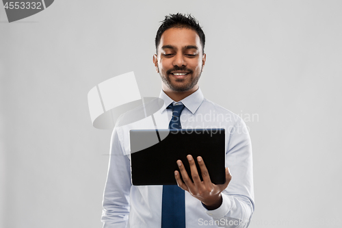 Image of indian businessman with tablet pc computer