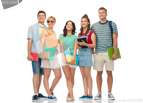 Image of students with notebooks, books and folders