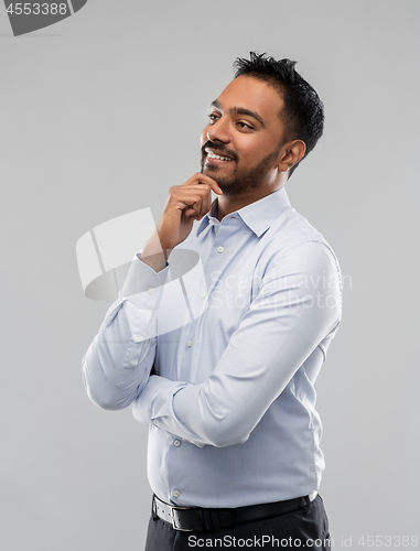 Image of indian businessman in shirt over grey background