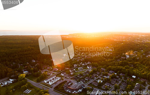 Image of aerial view of suburban houses near forest