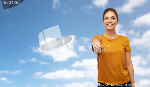 Image of woman or teenage girl in t-shirt showing thumbs up