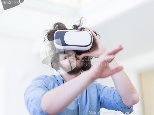 Image of man using VR-headset glasses of virtual reality