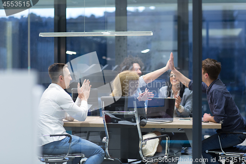 Image of startup Group of young business people celebrating success