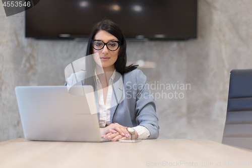 Image of businesswoman using a laptop in startup office