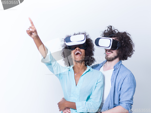 Image of multiethnic couple getting experience using VR headset glasses