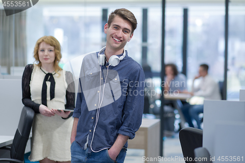 Image of Business People Working With Tablet in startup office