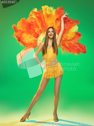 Image of young beautiful dancer posing on studio background