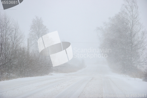 Image of Beautiful winter landscape with snowy road in the winter forest.