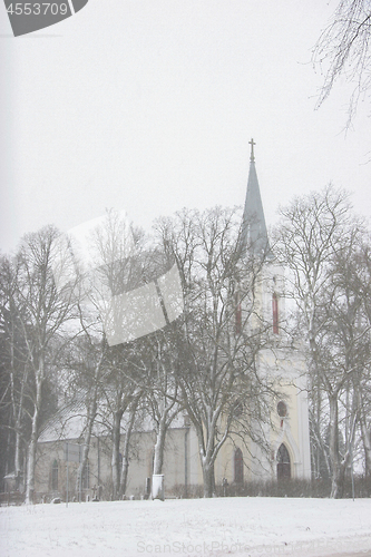 Image of Winter landscape with snow covered church and trees.