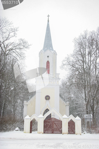Image of Winter landscape with snow covered church and trees.