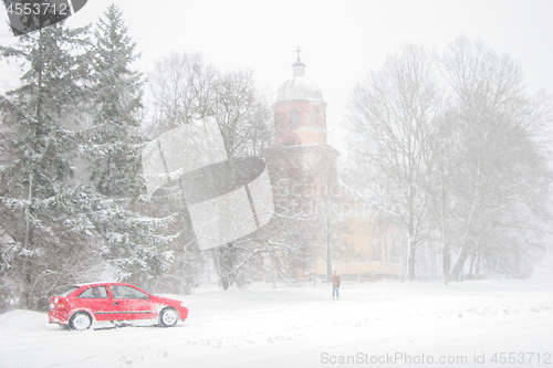 Image of Winter landscape with snow covered church and trees.