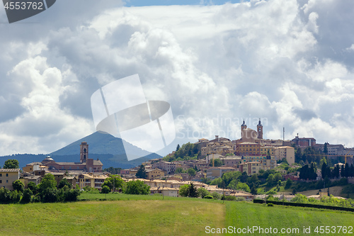 Image of Camerino in Italy Marche over colourful fields