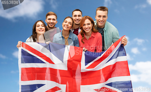 Image of group of smiling friends with british flag