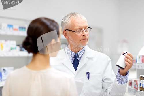 Image of apothecary and woman with drug at pharmacy