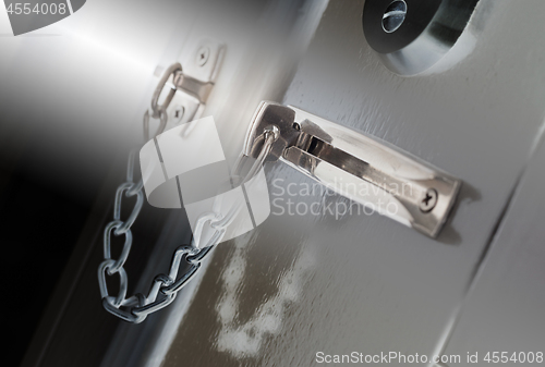 Image of Door chain on a grey door