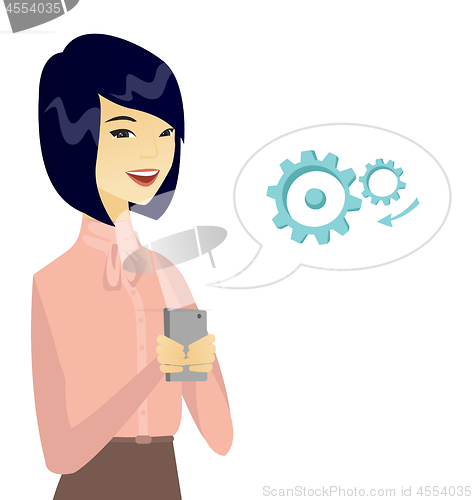 Image of Young asian business woman holding a mobile phone.