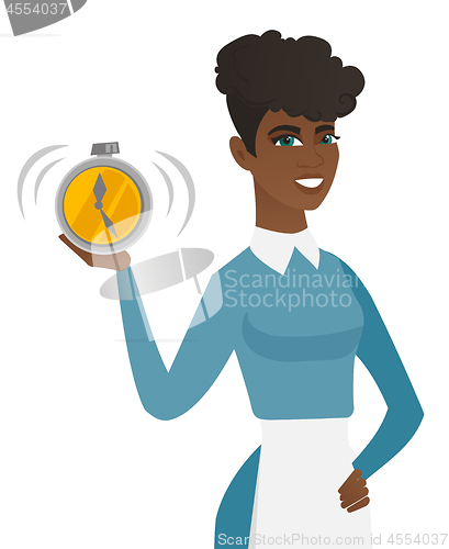 Image of Young african-american cleaner holding alarm clock