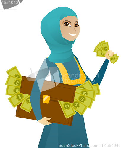 Image of Muslim business woman with briefcase full of money