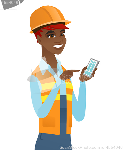 Image of Young african builder holding a mobile phone.
