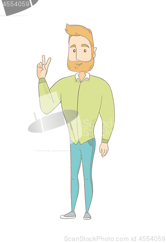 Image of Caucasian hippie man showing victory gesture.