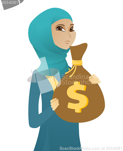 Image of Upset muslim business woman with bag full of taxes
