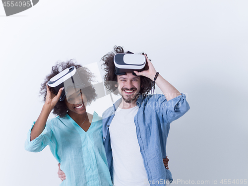 Image of multiethnic couple getting experience using VR headset glasses