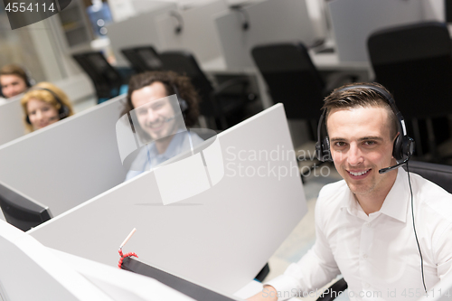 Image of male call centre operator doing his job