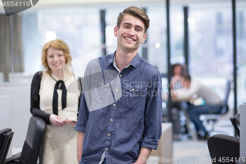 Image of Business People Working With Tablet in startup office