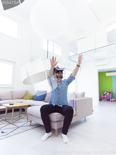 Image of man using VR-headset glasses of virtual reality