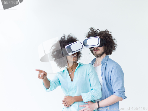 Image of multiethnic couple getting experience using VR headset glasses