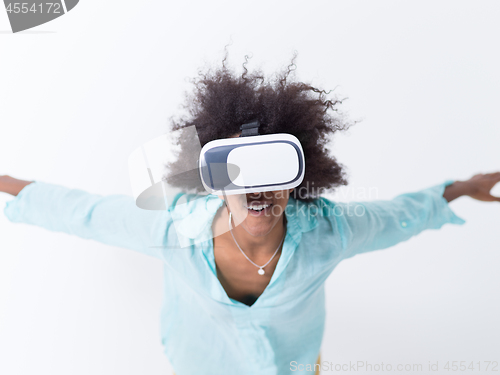 Image of black girl using VR headset glasses of virtual reality