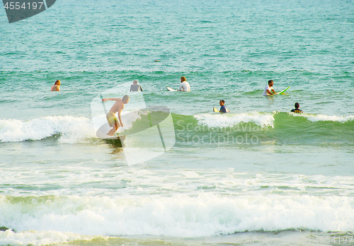 Image of Crowded Bali surfing line-up. Indonesia