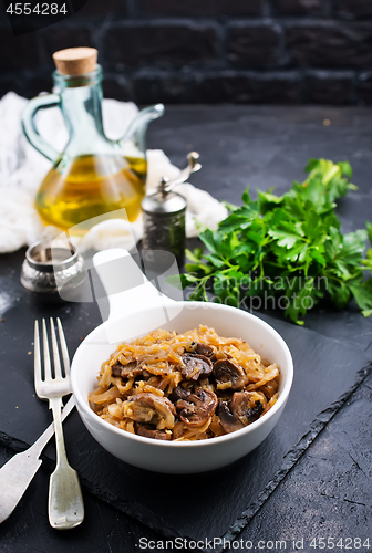 Image of fried cabbage with mushrooms